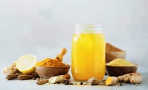 A tantalizing glimpse into a potent elixir, blending the goodness of turmeric and other ingredients for a refreshing and health-boosting shot.